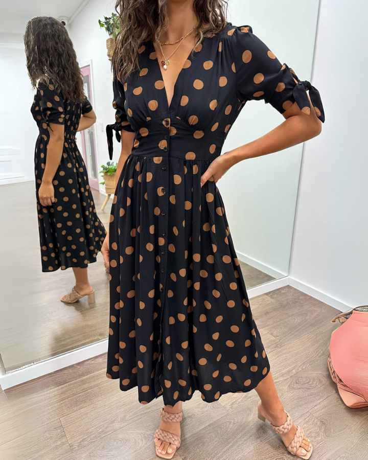 Józefa | Rozkloszowana sukienka w grochy z mankietami wiązanymi na kokardę