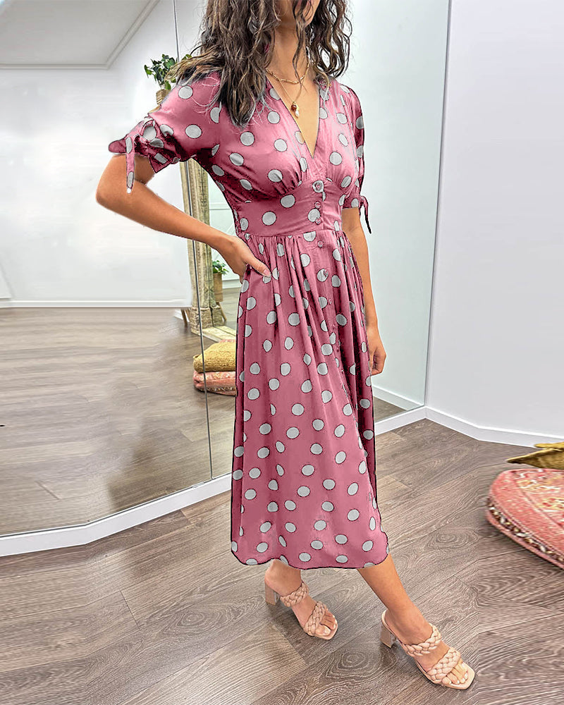 Józefa | Rozkloszowana sukienka w grochy z mankietami wiązanymi na kokardę